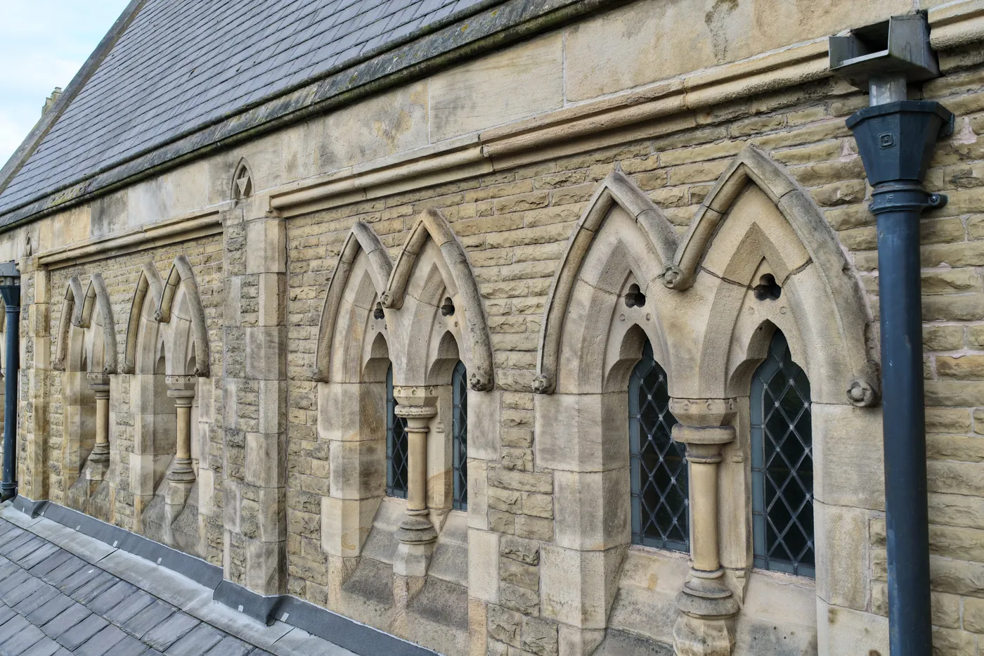 Clerestory arcading and shafted windows photographed from roof level
