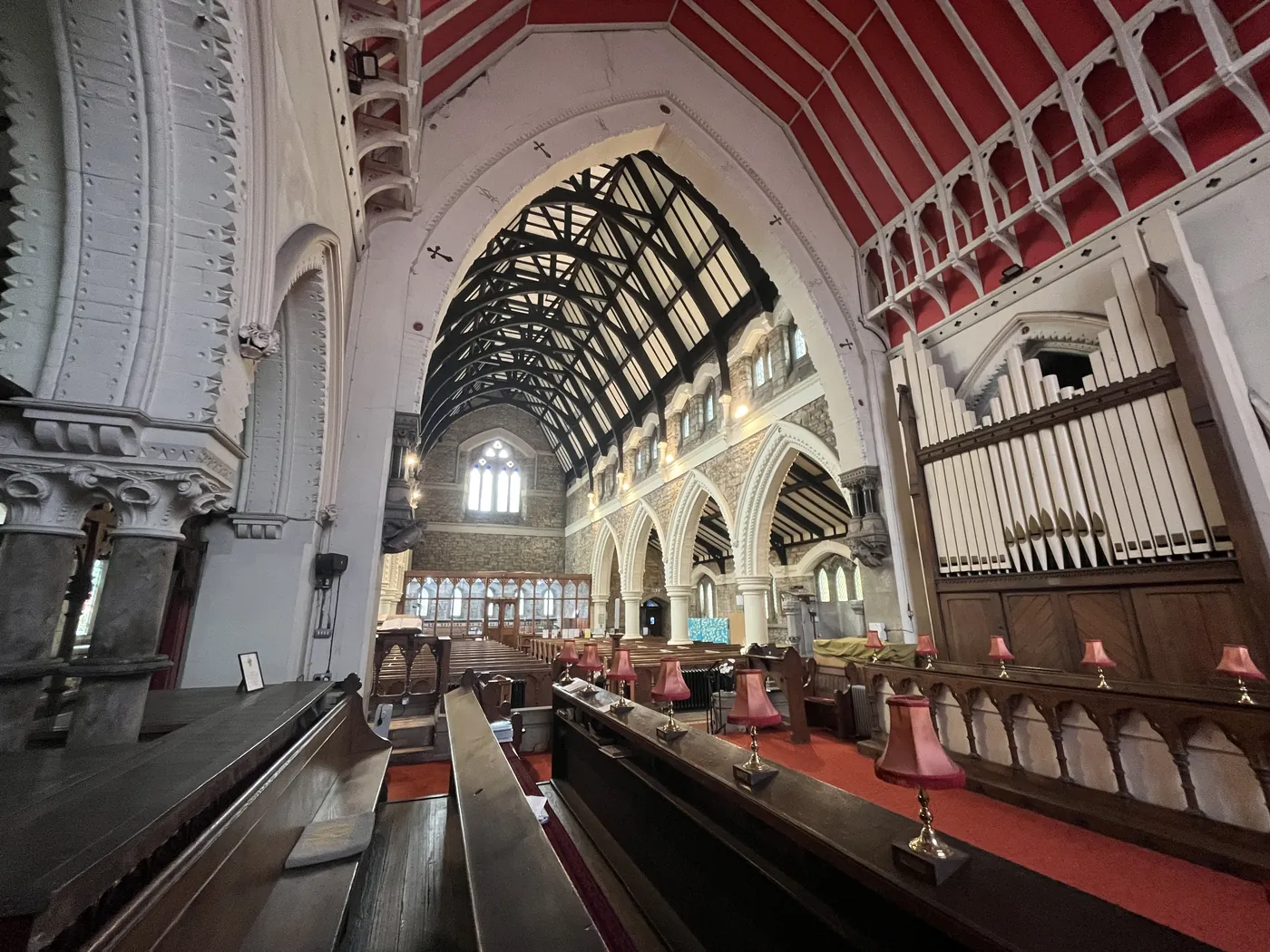 Wide view through the nave and arcades of St Thomas