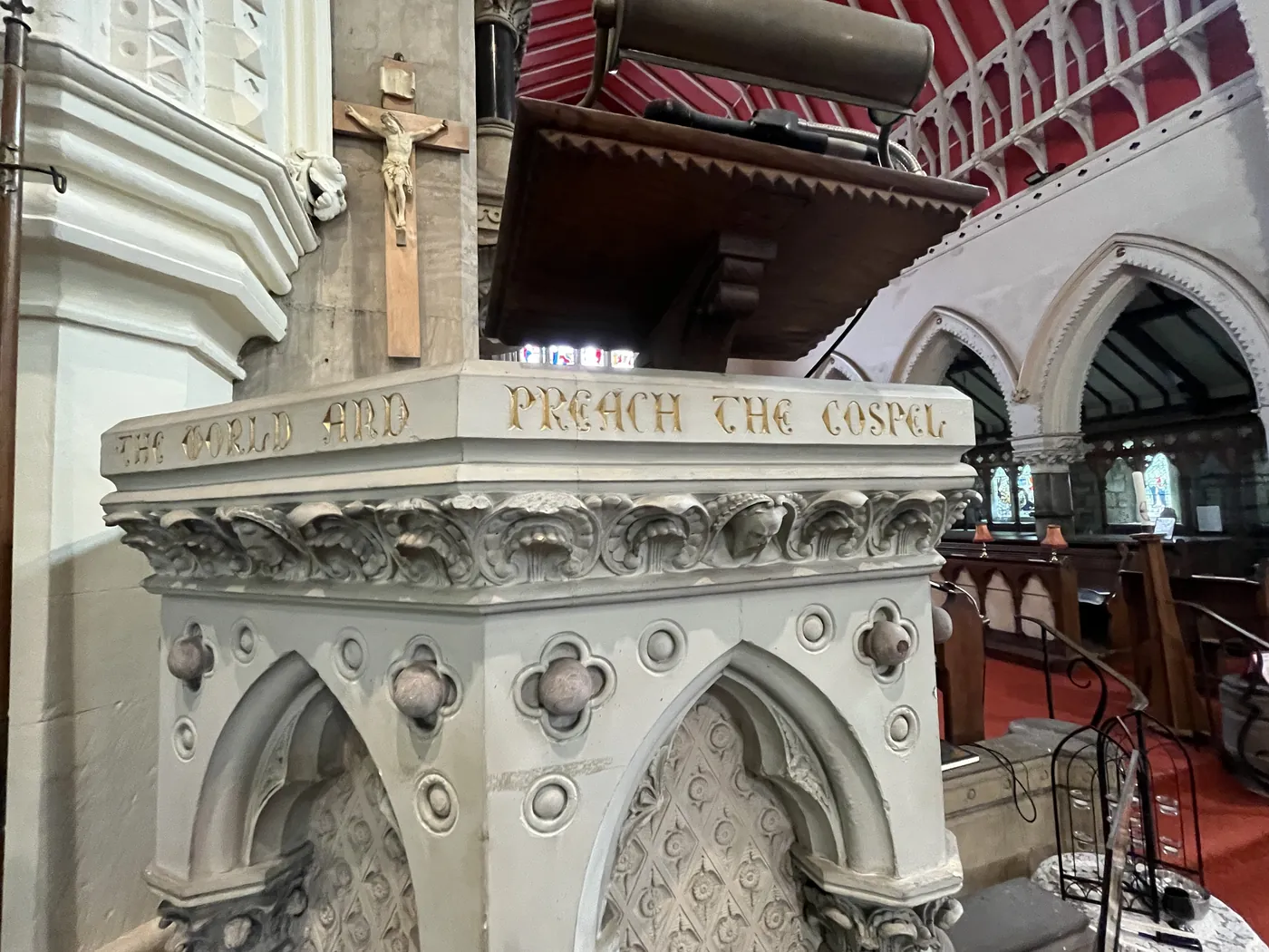 Pulpit inscription reading Go ye into all the world and preach the gospel