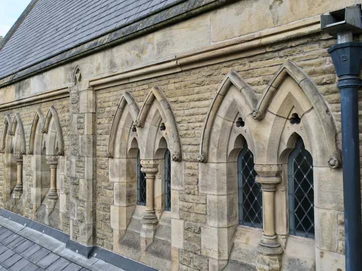 Clerestory arcading and shafted windows photographed from roof level