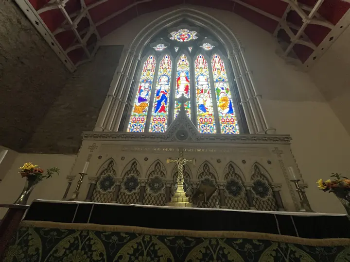 The high altar beneath the stained-glass east window