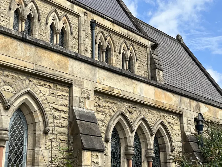 Exterior lancet windows in the stone south wall