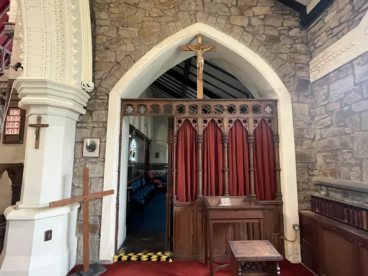 Gothic timber screen and arched doorway