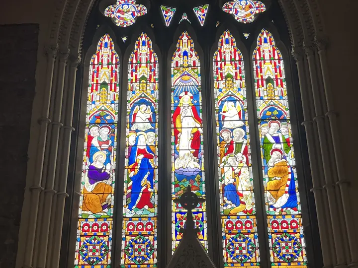 Portrait view of the richly coloured east window