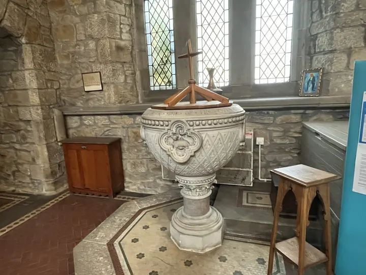 Side view of the carved baptismal font