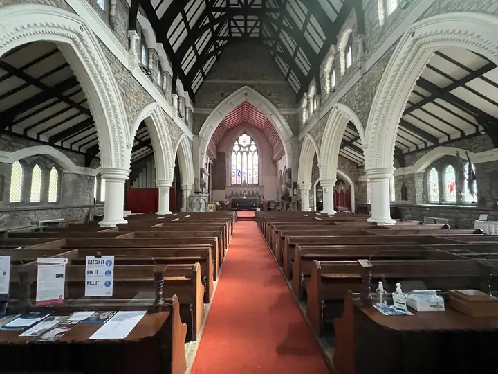 Central aisle leading through pews to the east window